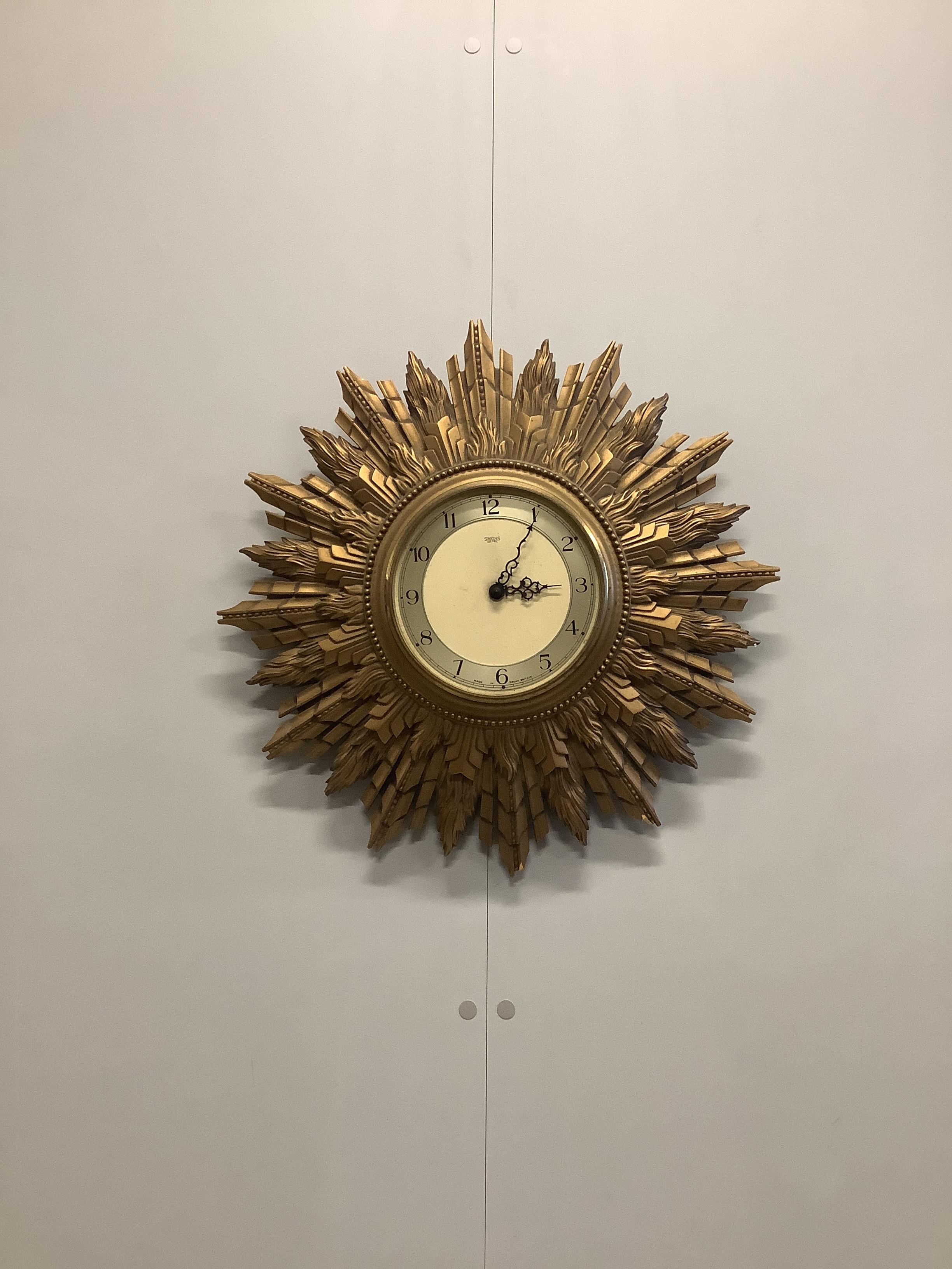 A Smith's electric sunburst wall timepiece, diameter 50cm